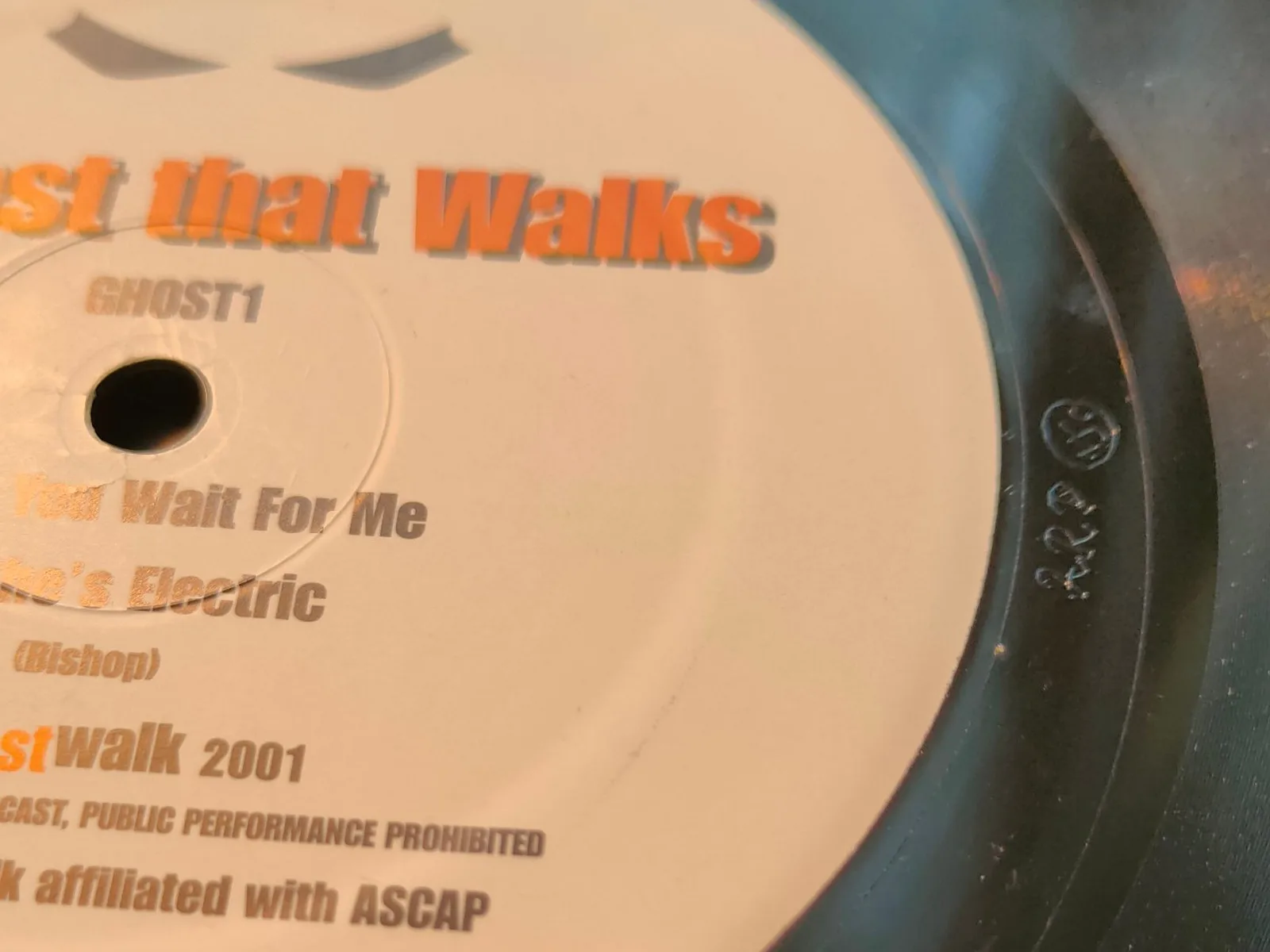 Close-up of the GHOST 1 record: the B-side label and the runout groove etched ARP and NSC